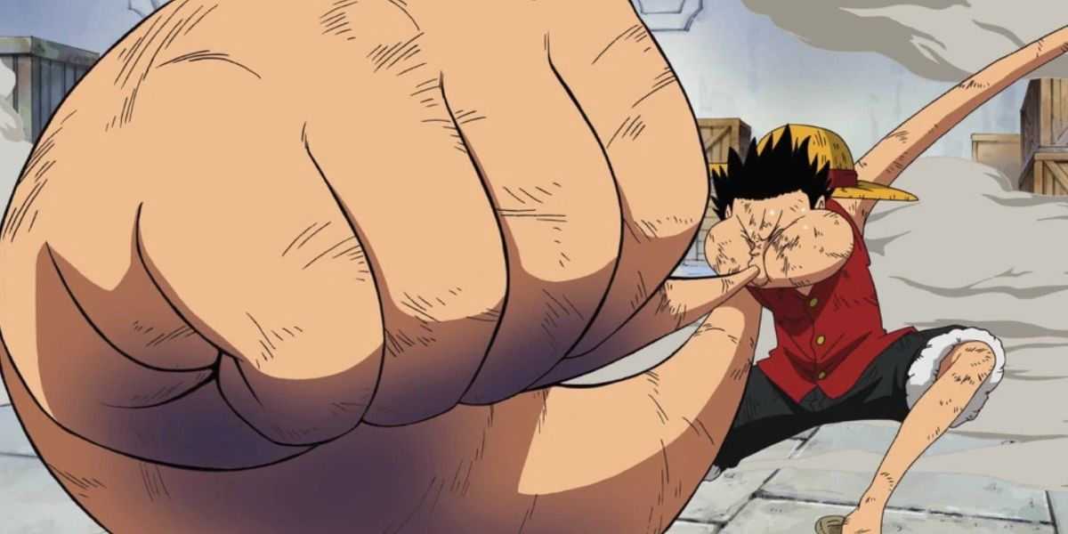 Luffy blows air into his hand to trigger Gear 3 in One Piece