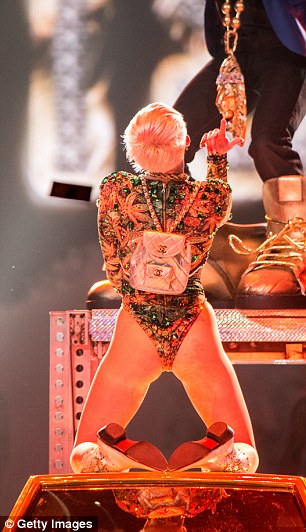 Reach for the sky: Miley is on good form as she performs on Thursday