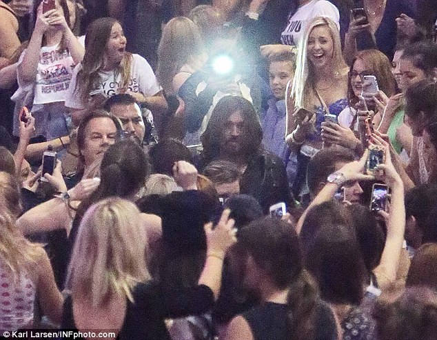 A face in the crowd: Billy Ray Cyrus makes his way past camera wielding fans on Thursday evening