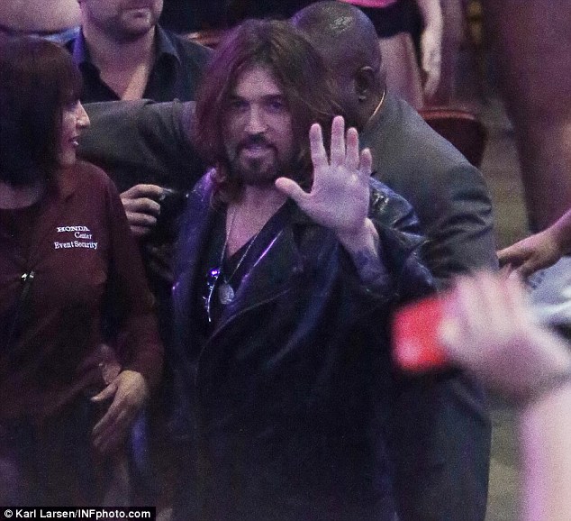 Standing out: Billy Ray has a wave for the cameras