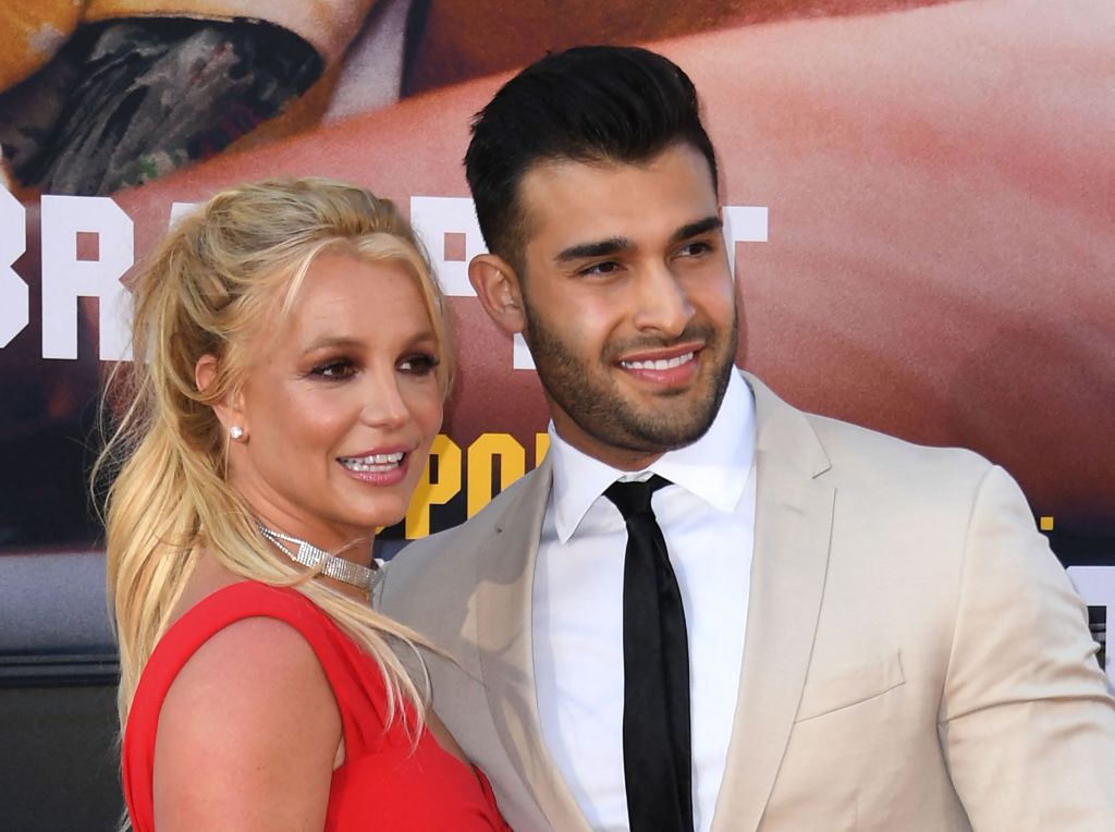 Britney Spears cuddles up to Sam Asghari.