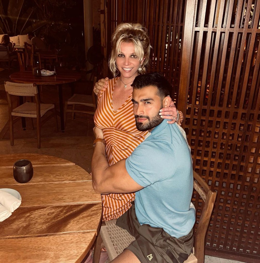 Britney cuddles Sam Asghari.