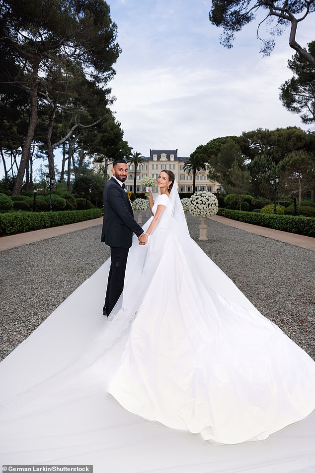 The newlyweds could not stop smiling as they held hands and had pictures taken outside the exclusive resort