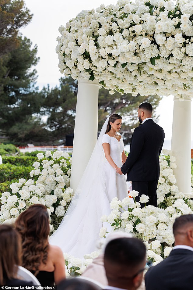 Fast fashion boss Umar looked incredibly dapper as he waited under a seaside gazebo in a classic Tom Ford tuxedo