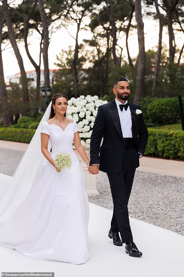 The couple are pictured walking down the aisle in the French Riviera on Friday