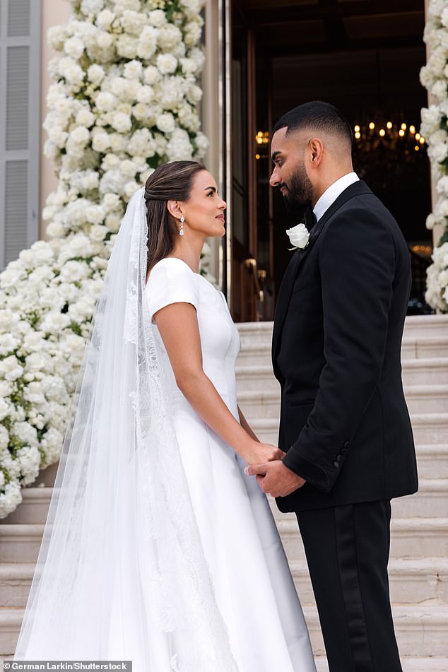 The pair looked lovingly into each other's eyes as they posed for pictures to remember their special day