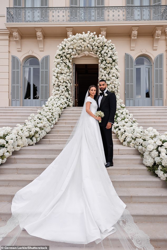 Nada and Umar Kamani pose together outside the Hotel du Cap-Eden-Roc on Friday