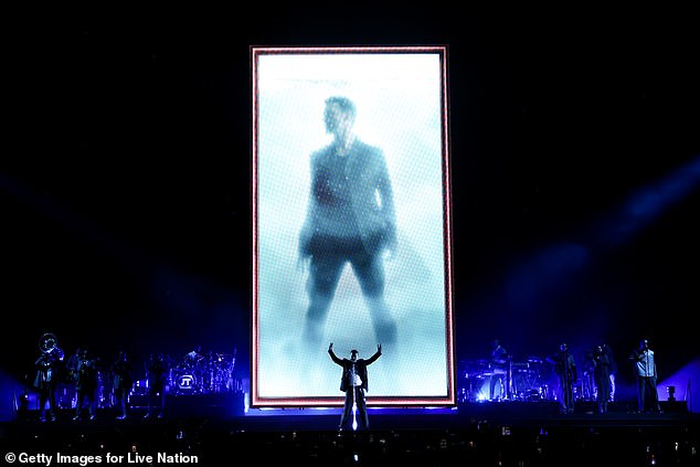 Timberlake had on a harness that kept him from falling and allowed him to stay upright, but the platform also returned to the ground and served as a video screen