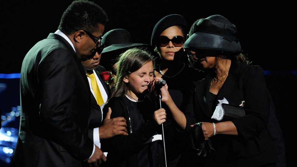 Paris Jackson with Jackson family, speaking into microphone