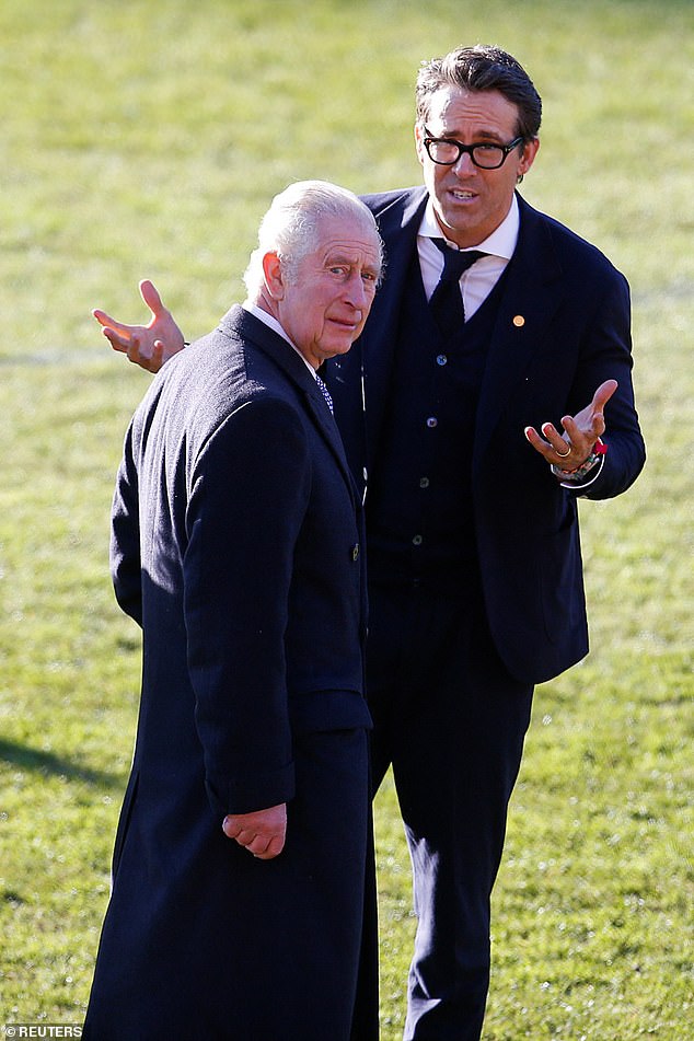 King Charles pictured with Ryan Reynolds during a visit to Wrexham AFC's stadium the Racecourse in December 2022