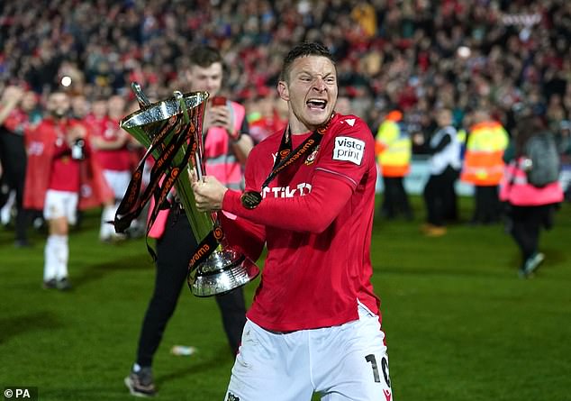 Paul Mullin, pictured here lifting the National League trophy, has previously landed himself in hot water for his political statements