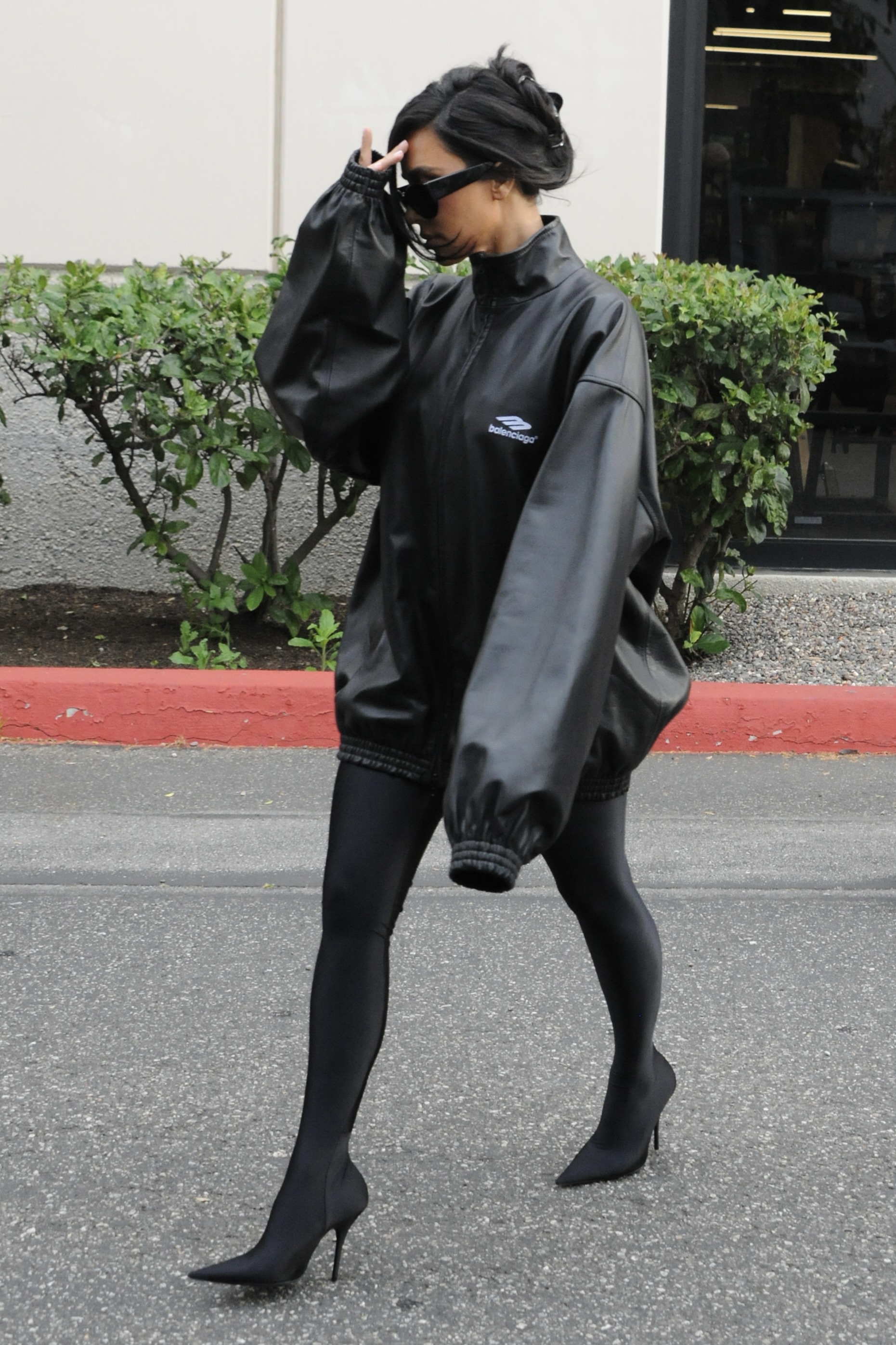 Kim was previously accused of copying the designer's style after wearing an oversized black jacket that covered her wrists and hands