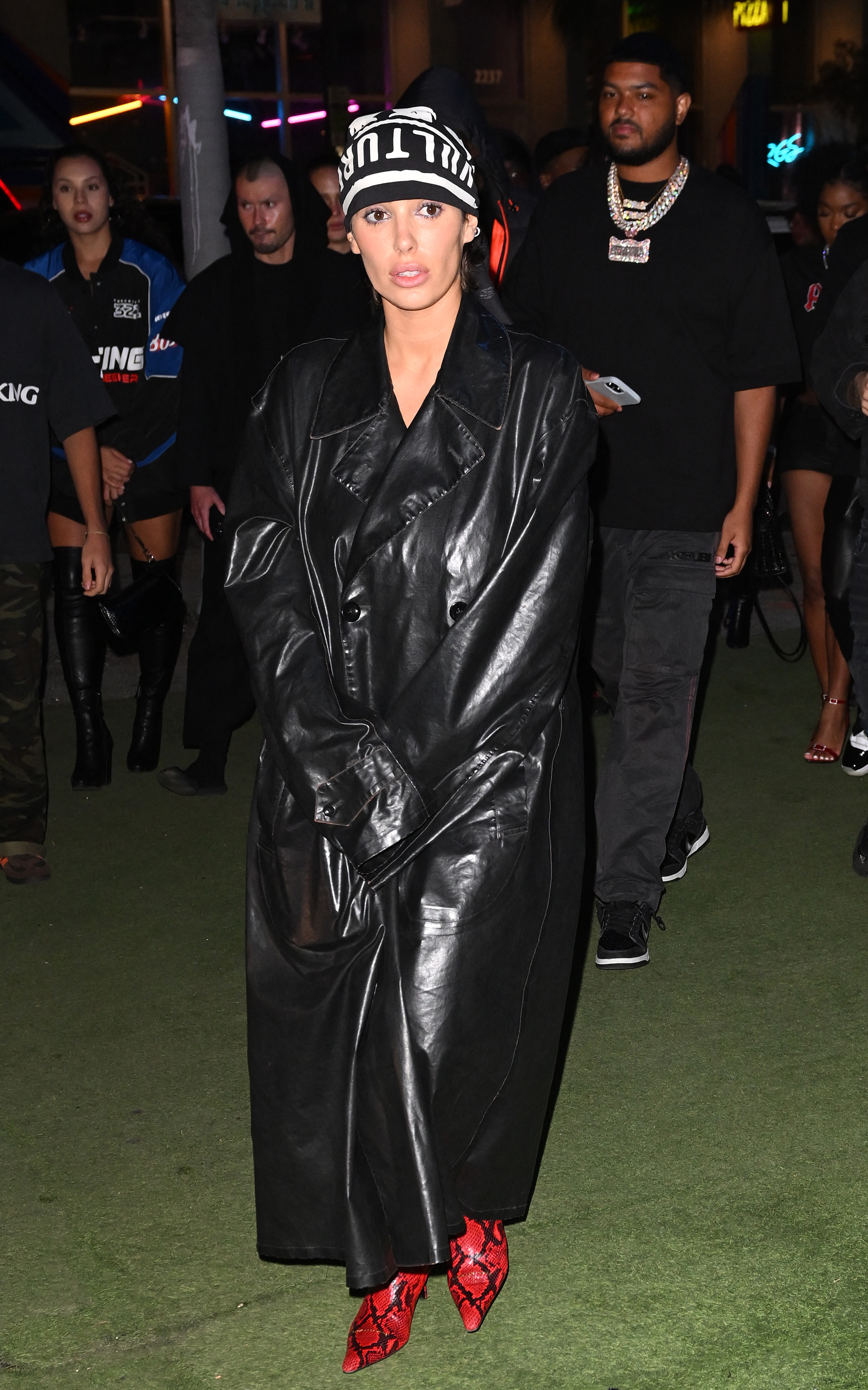 Bianca had worn a similar black trench coat months before that featured oversized sleeves