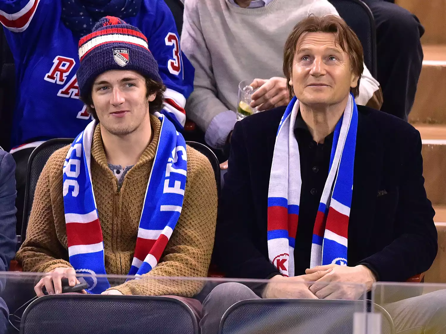 Daniel Neeson and Liam Neeson attend Ottawa Senators vs New York Rangers game at Madison Square Garden on January 20, 2015.