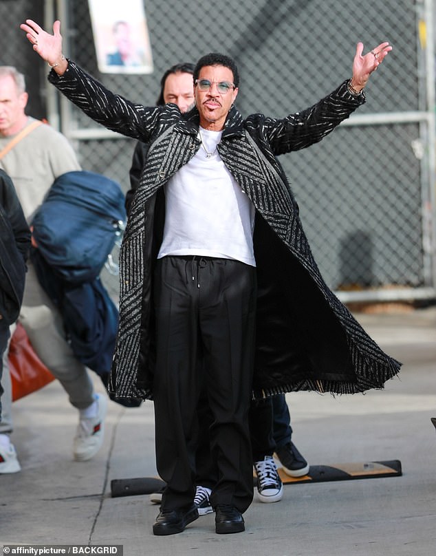 Arms up: The singer raised his arms as he acknowledged his fans