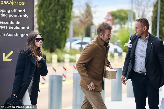 Victoria wrapped up from the wind in a thick black blazer jacket