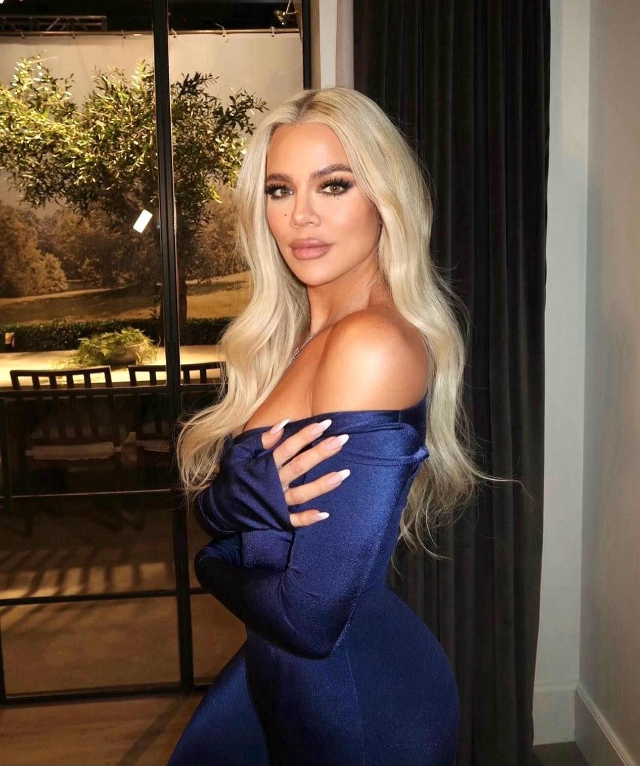 Khloé Kardashian in a blue dress.