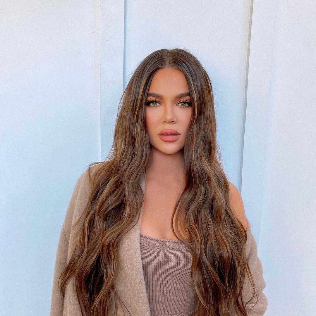 Khloé Kardashian with brown hair.