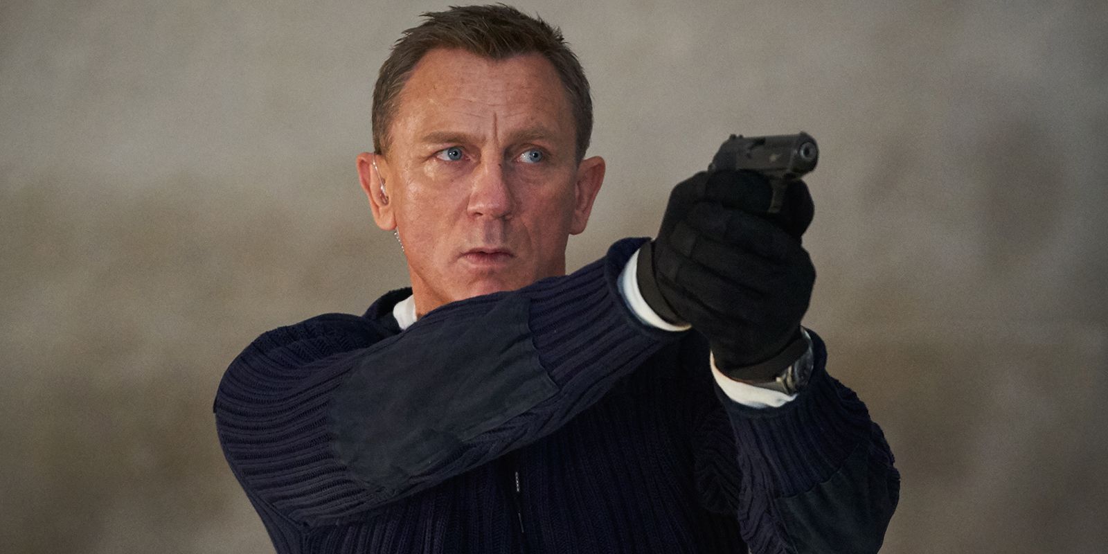 James Bond pointing a gun in No Time to Die