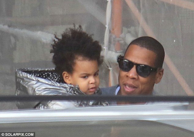 Beyoncé gets snap happy in Barcelona as Jay Z cradles Blue Ivy | Daily Mail Online