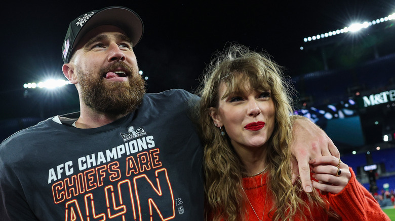 Travis Kelce and Taylor Swift smiling