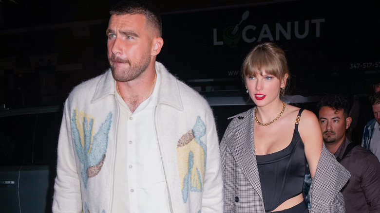 Travis Kelce and Taylor Swift walking