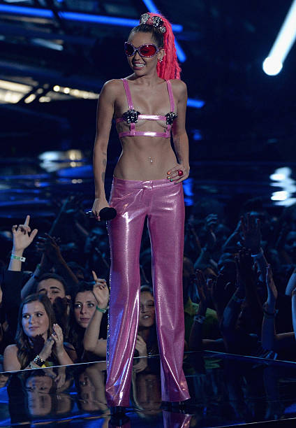 Host Miley Cyrus, styled by Simone Harouche, speaks onstage during the 2015 MTV Video Music Awards at Microsoft Theater on August 30, 2015 in Los...