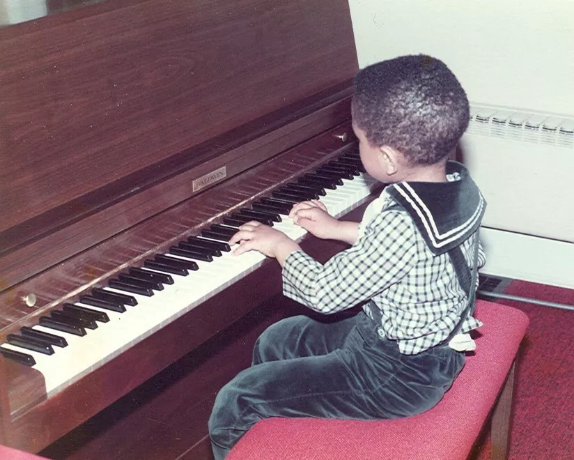 John legend playing the piano as a child