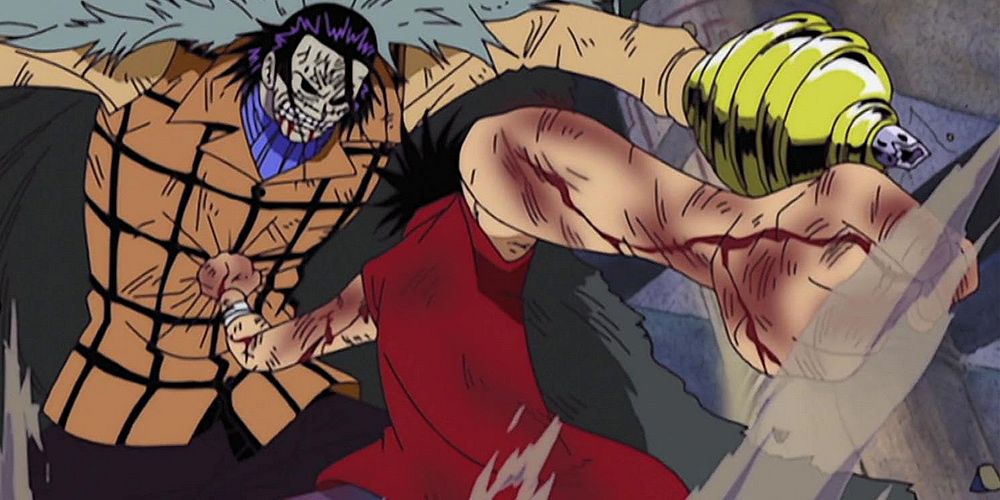 Monkey D. Luffy punches Crocodile in the stomach during a fight in One Piece