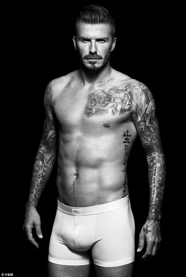 Smouldering: The footballer shows off his tone physique and many tattoos in the black and white shots