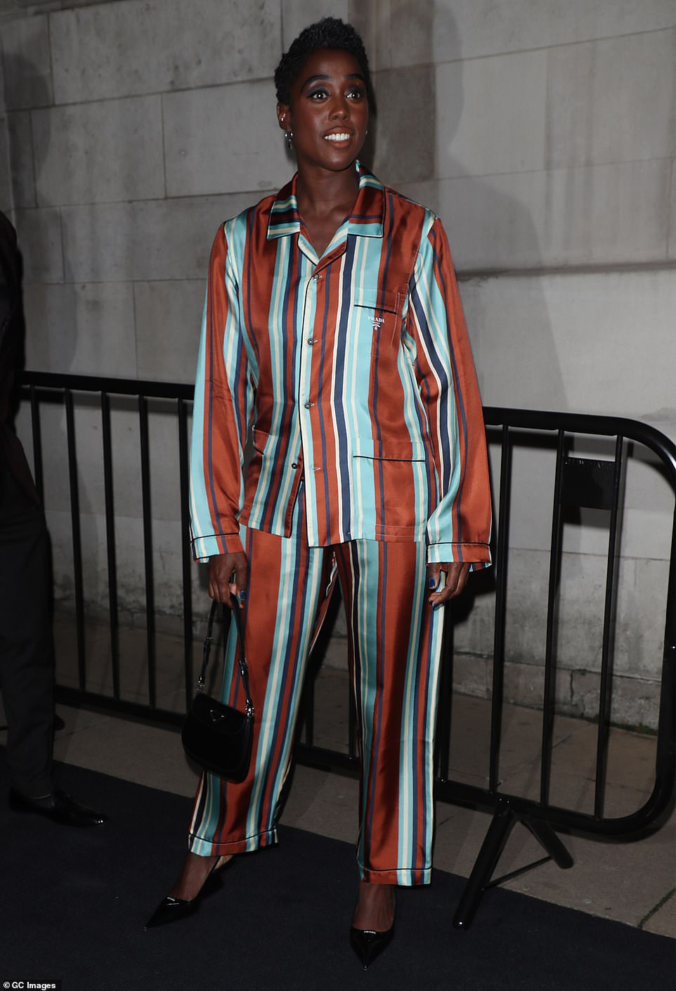 Fashion flaunting: Lashana Lynch looked phenomenal in  a satin Prada ensemble