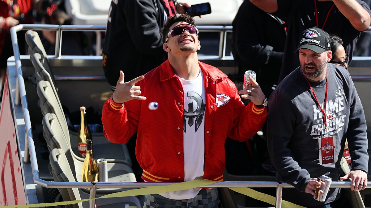 Feb 14, 2024; Kansas City, MO, USA; Kansas City Chiefs quarterback Patrick Mahomes (15) celebrates on the bus in the parade during the celebration of the Kansas City Chiefs winning Super Bowl LVIII. Mandatory Credit: Julia Kapros-USA TODAY Sports