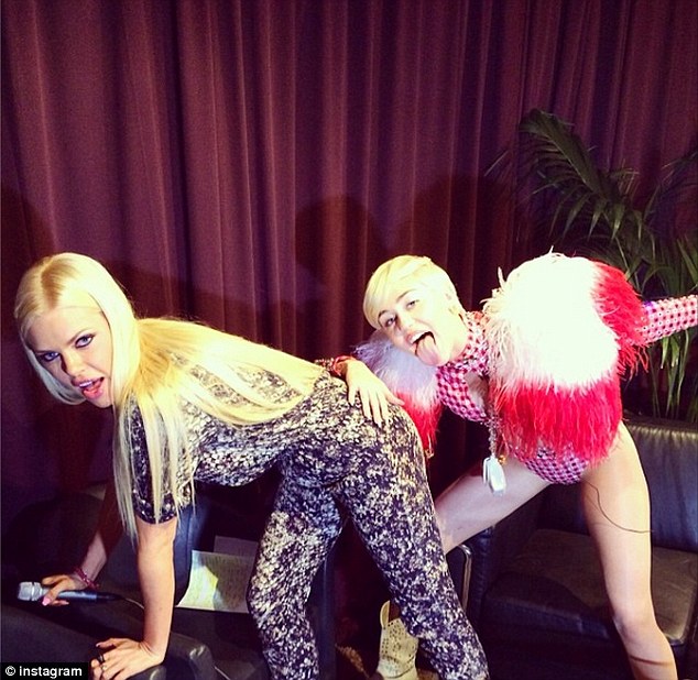 Twerking it! Australian radio personality Sophie Monk posted this photo on Instagram on Friday, as she gets some twerking tips from Miley Cyrus during an interview, backstage at Miley's concert in Antwerp, Belgium