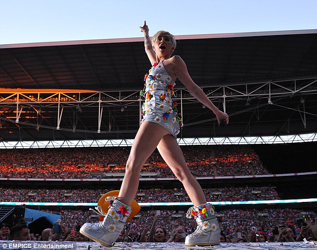 Just for her: Miley wore a silver miniskirt and top made for her by Jeremy Scott for Moschino