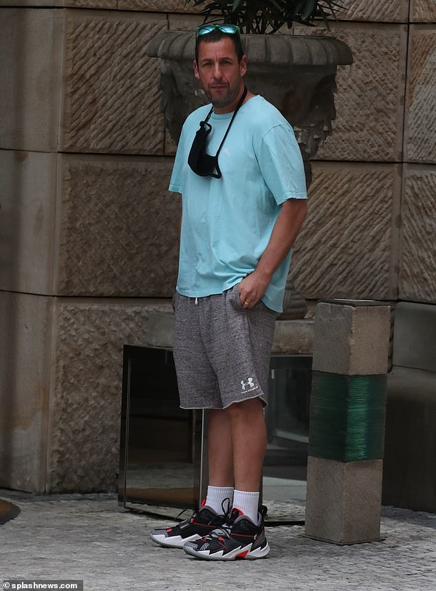 Casual: Adam Sandler made the most of his downtime as he stepped out for a walk around the city and met with fans on Wednesday ahead of filming his new movie, Spaceman