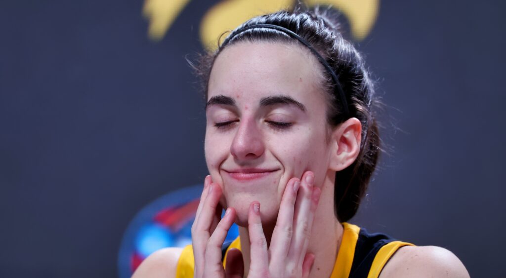 Caitlin Clark smiling at press conference