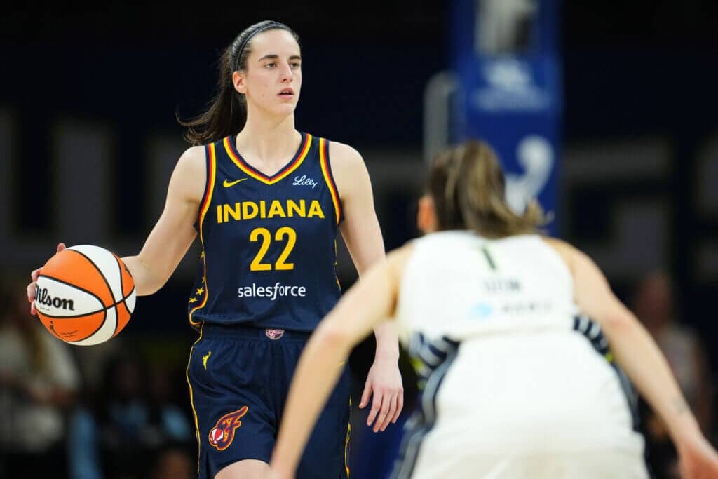 ARLINGTON, TX - MAY 3: Caitlin Clark #22 of the Indiana Fever dribbles the ball during the game against the Dallas Wings during the WNBA Preseason Game on May 3, 2024 at the College Park Center in Arlington, Texas. NOTE TO USER: User expressly acknowledges and agrees that, by downloading and or using this photograph, user is consenting to the terms and conditions of the Getty Images License Agreement. Mandatory Copyright Notice: Copyright 2024 NBAE (Photos by Cooper Neill/NBAE via Getty Images)