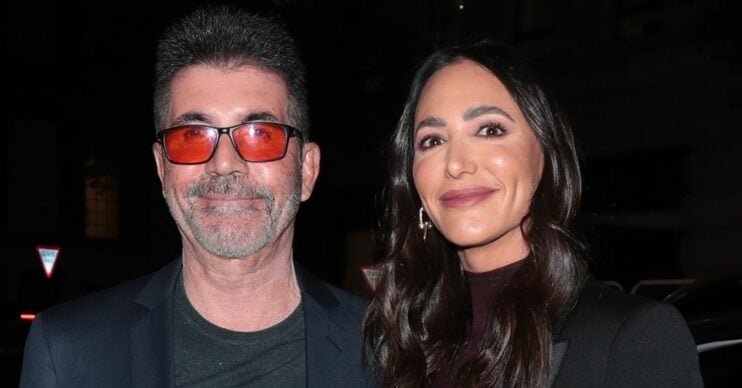 Simon Cowell and Lauren Silverman smiling