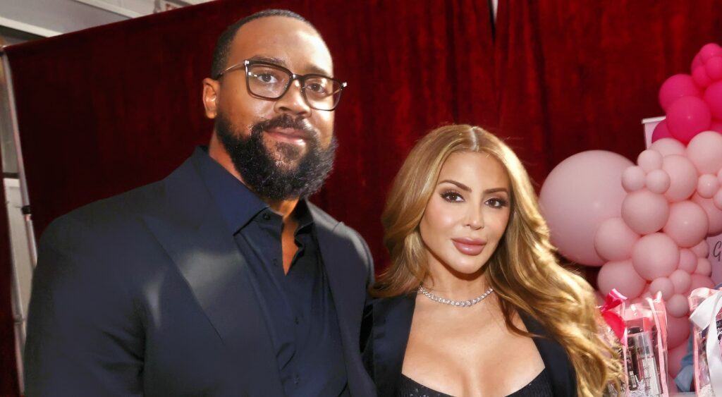 Larsa Pippen and Marcus Jordan posing.