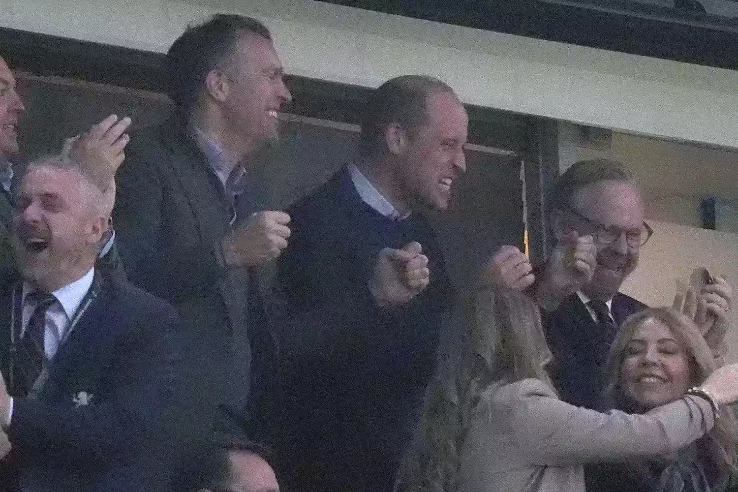 The Prince of Wales celebrates a disallowed goal in the stands during the UEFA Conference League semi-final, first leg match at Villa Park