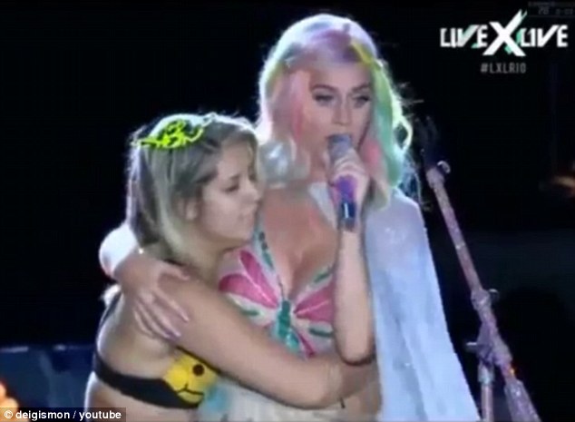 Katy Perry is kissed and groped by a fan on stage during Rio concert |  Daily Mail Online