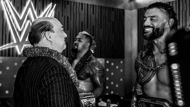 Paul Heyman and Roman Reigns backstage