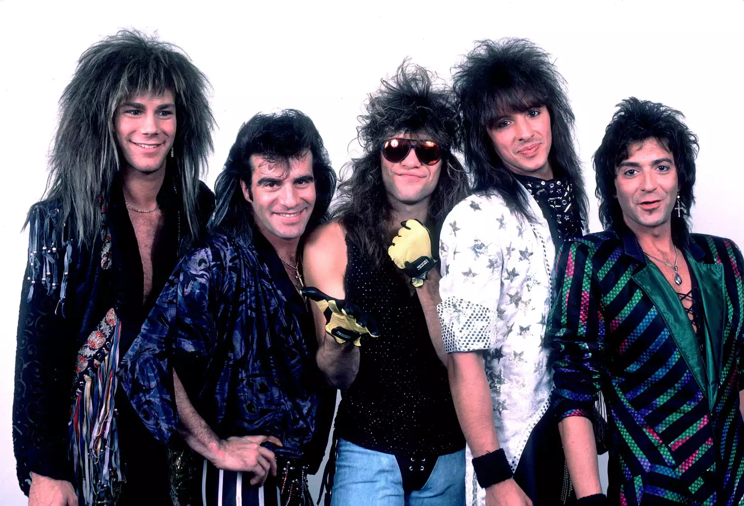 Portrait of American rock band Bon Jovi backstage before a performance, Illinois, early March, 1987. Pictured are, from left, David Bryan, Tico Torres, Jon Bon Jovi, Richie Sambora, and Alec John Such. (Photo by Paul Natkin/Getty Images)