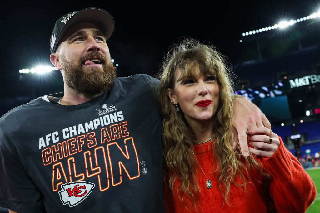 Travis Kelce #87 of the Kansas City Chiefs (L) celebrates with Taylor Swift after defeating the Baltimore Ravens in the AFC Championship Game at M&...