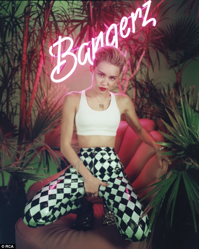 She's definitely not shy: The former Disney star grabs her crotch in a promo sH๏τ for her new album Bangerz