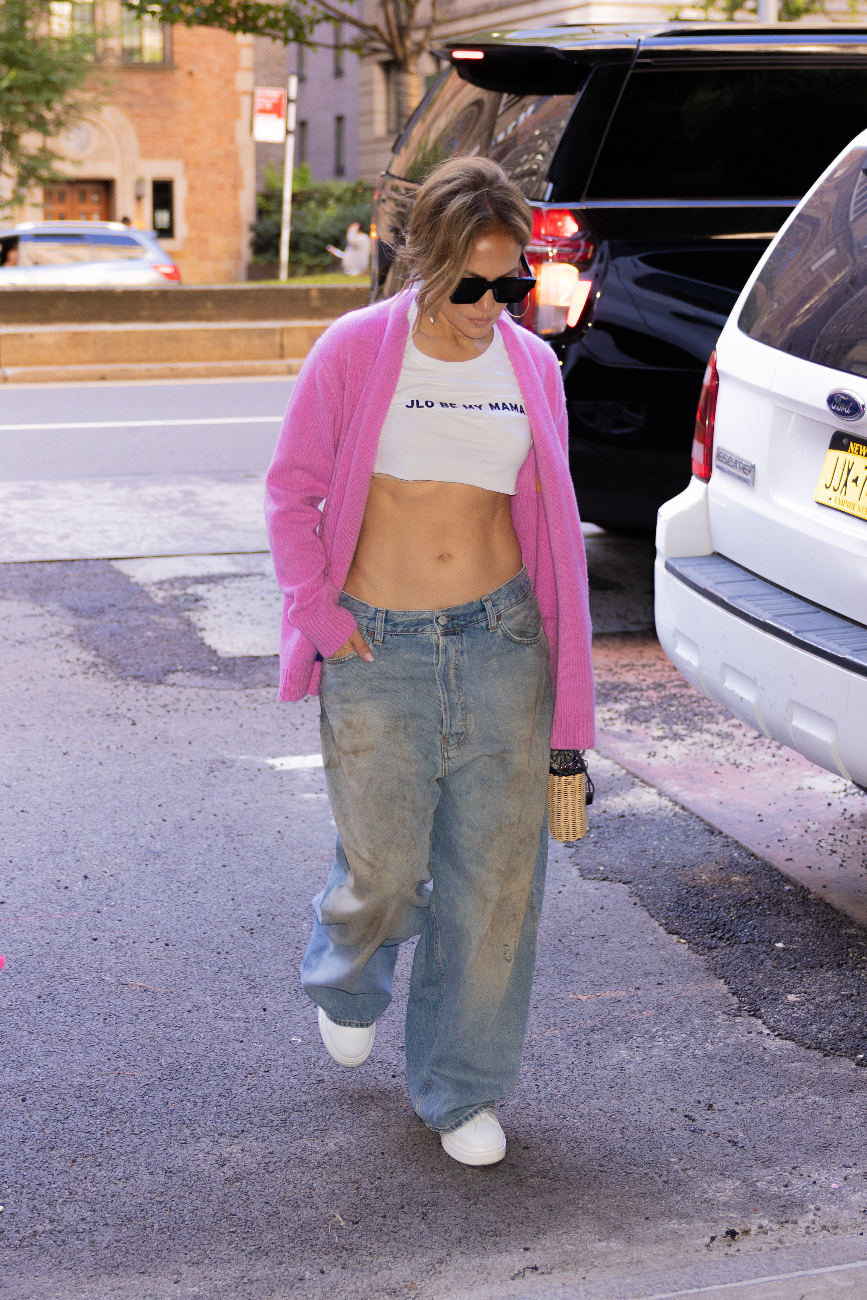 jennifer lopez in a crop top that reads "jlo be my mama"