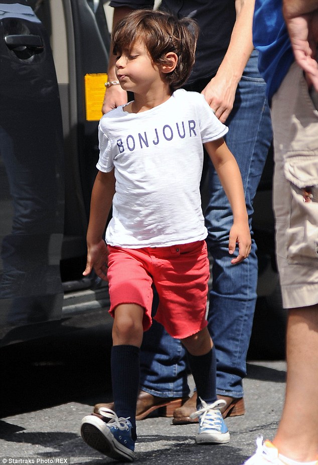 Mummy time: The star was joined by her adorable son Max who wore red shorts and a T-shirt with the French word for hello on it