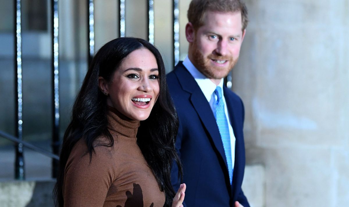 Prince Harry and Meghan Markle smiling