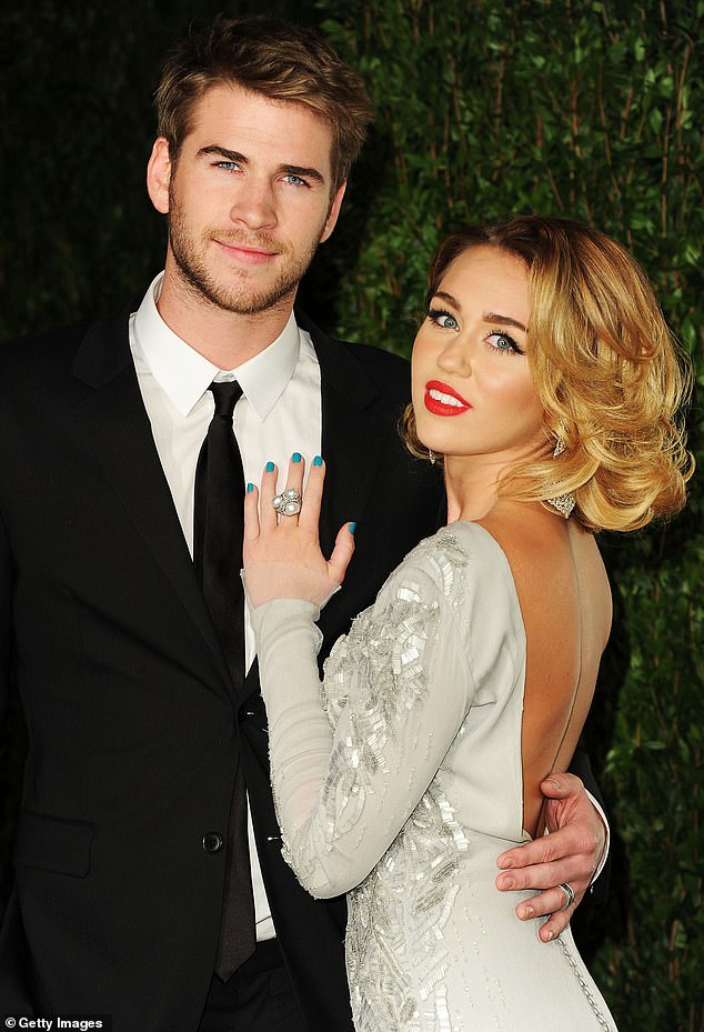 Full of love: Cyrus was married to Liam Hemsworth, 31, from 2018 to 2020, and she's dated Cody Simpson, 24, Nick Jonas, 28, Patrick Schwarzenegger, 27, Stella Maxwell, 30, and Kaitlynn Carter, 32 (pictured with Hemsworth in February, 2012)