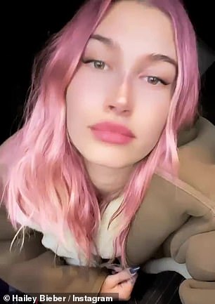 The model styled her pink locks wavy